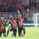 Pemain Persipura Jayapura dalam laga kompetisi domestik